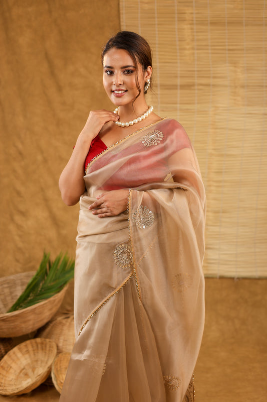 Organza golden saree with gottapatti work and matching saree