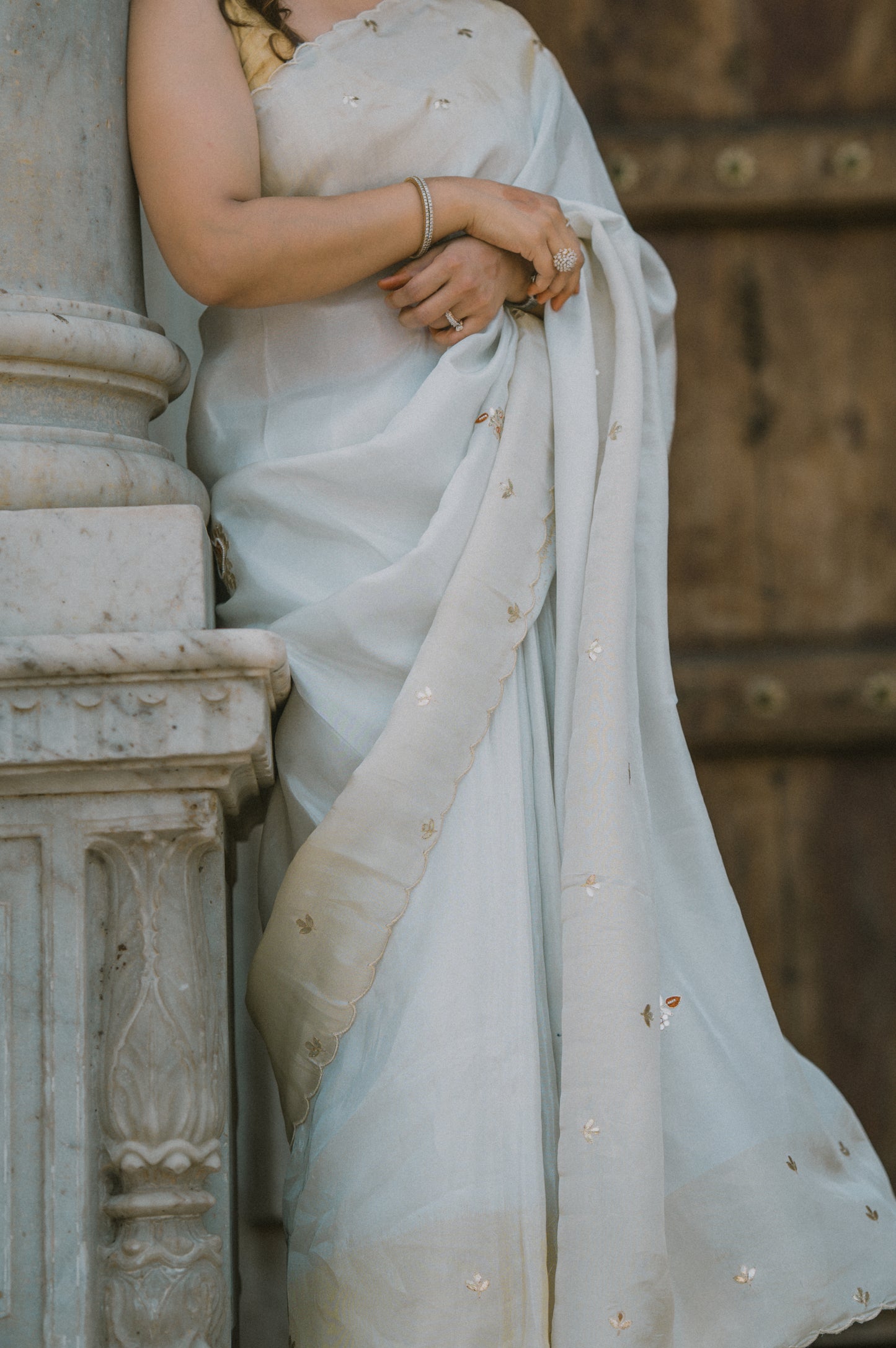 Cream & golden satin silk saree With orange gottapatti motifs