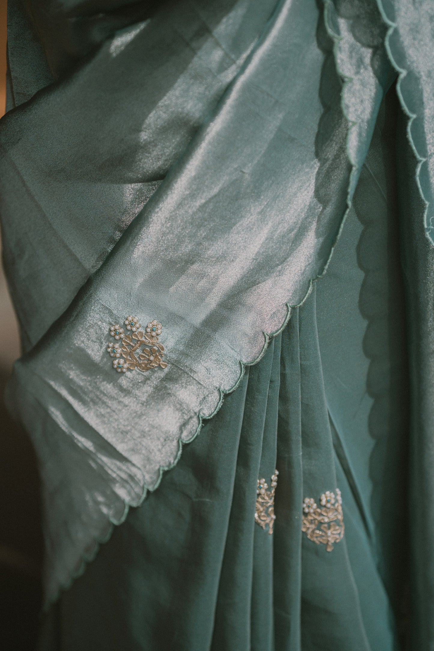 Ocean blue saree with zardosi and sequins threadwork and floral motifs