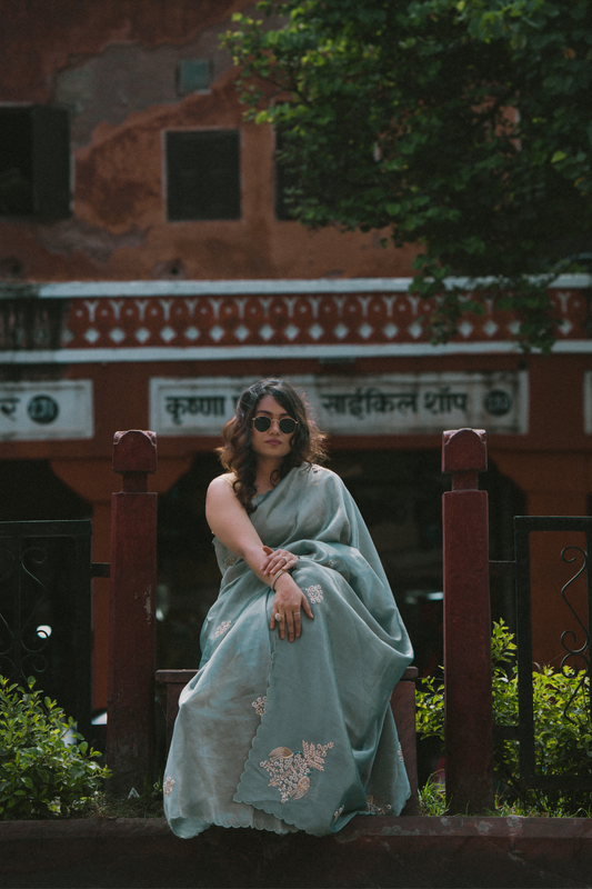 Ocean blue saree with zardosi and sequins threadwork and floral motifs
