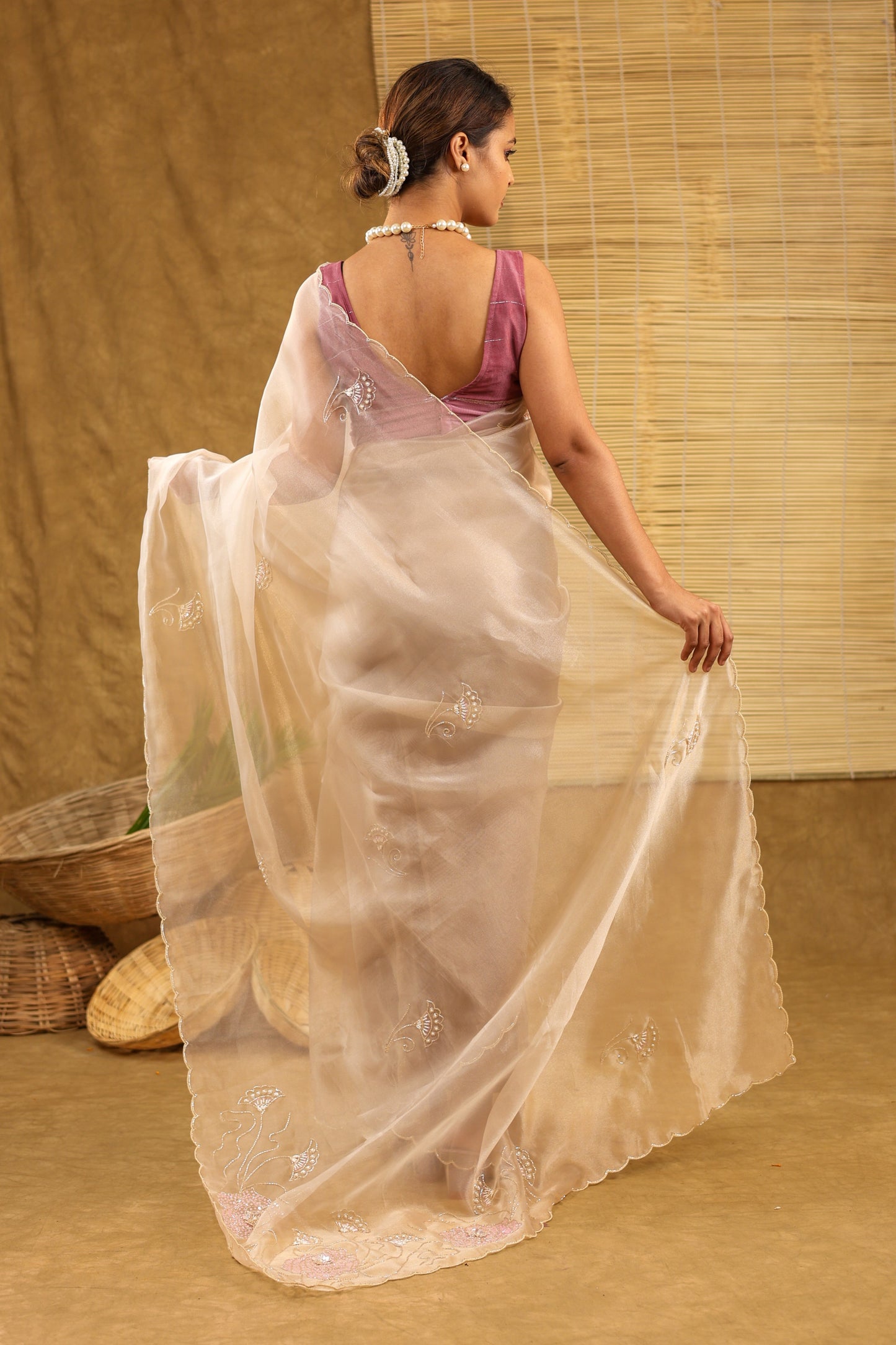 Organza golden saree with sequins work and matching blouse