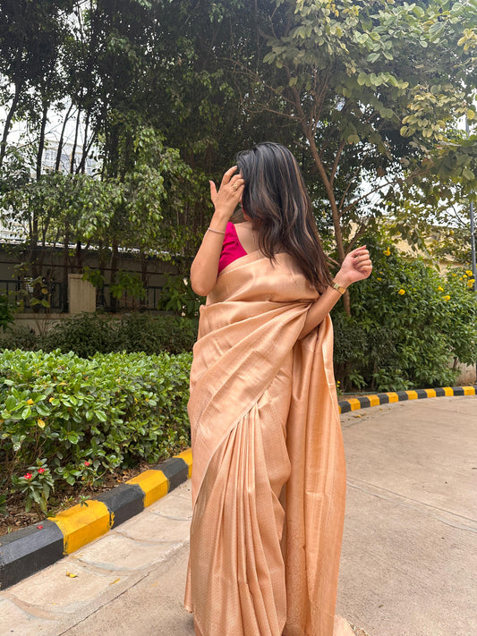 Bright cream saree with golden thread self work