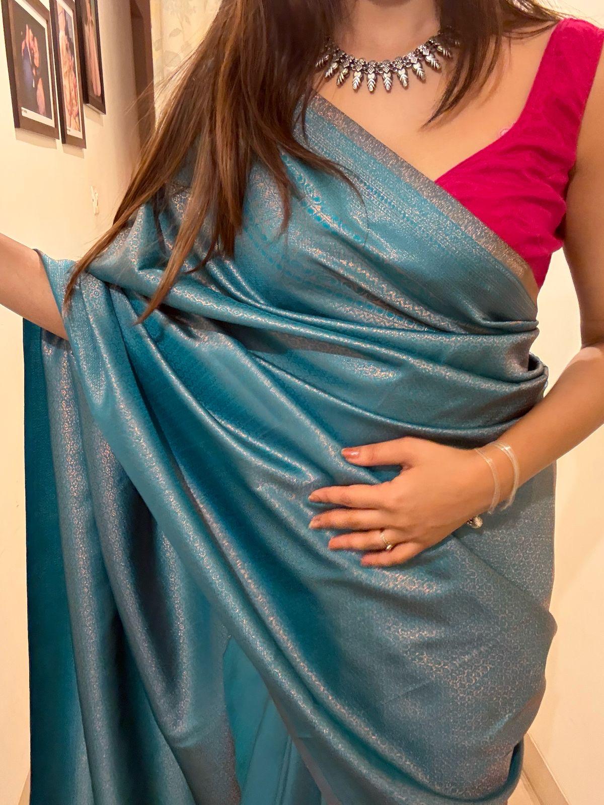 Turquoise blue saree with golden thread self work