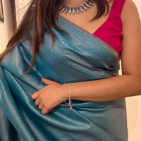 Turquoise blue saree with golden thread self work